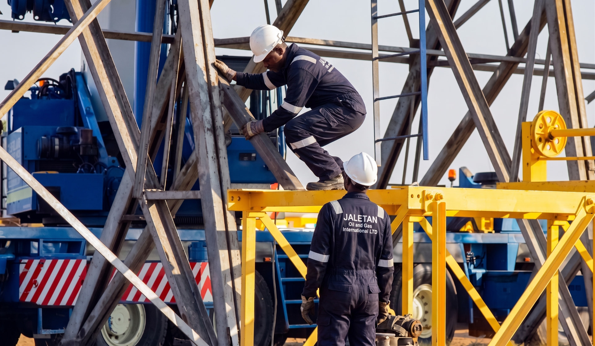 Jaletan workers assembling a structural steel framework on site